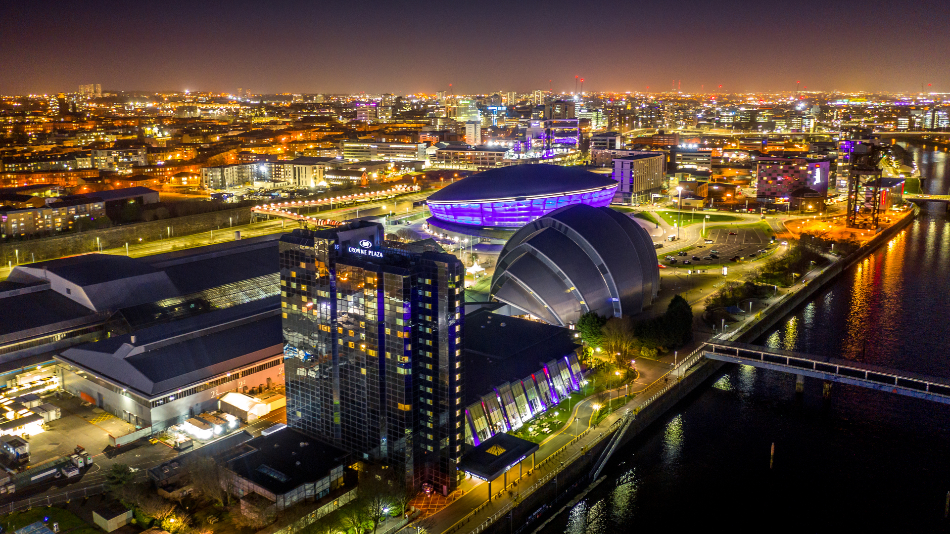 Glasgow cityscape at night featuring the SSE Hydro arena